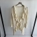 Casaco Feminino Tricot com Babados e Punho Flare - Off